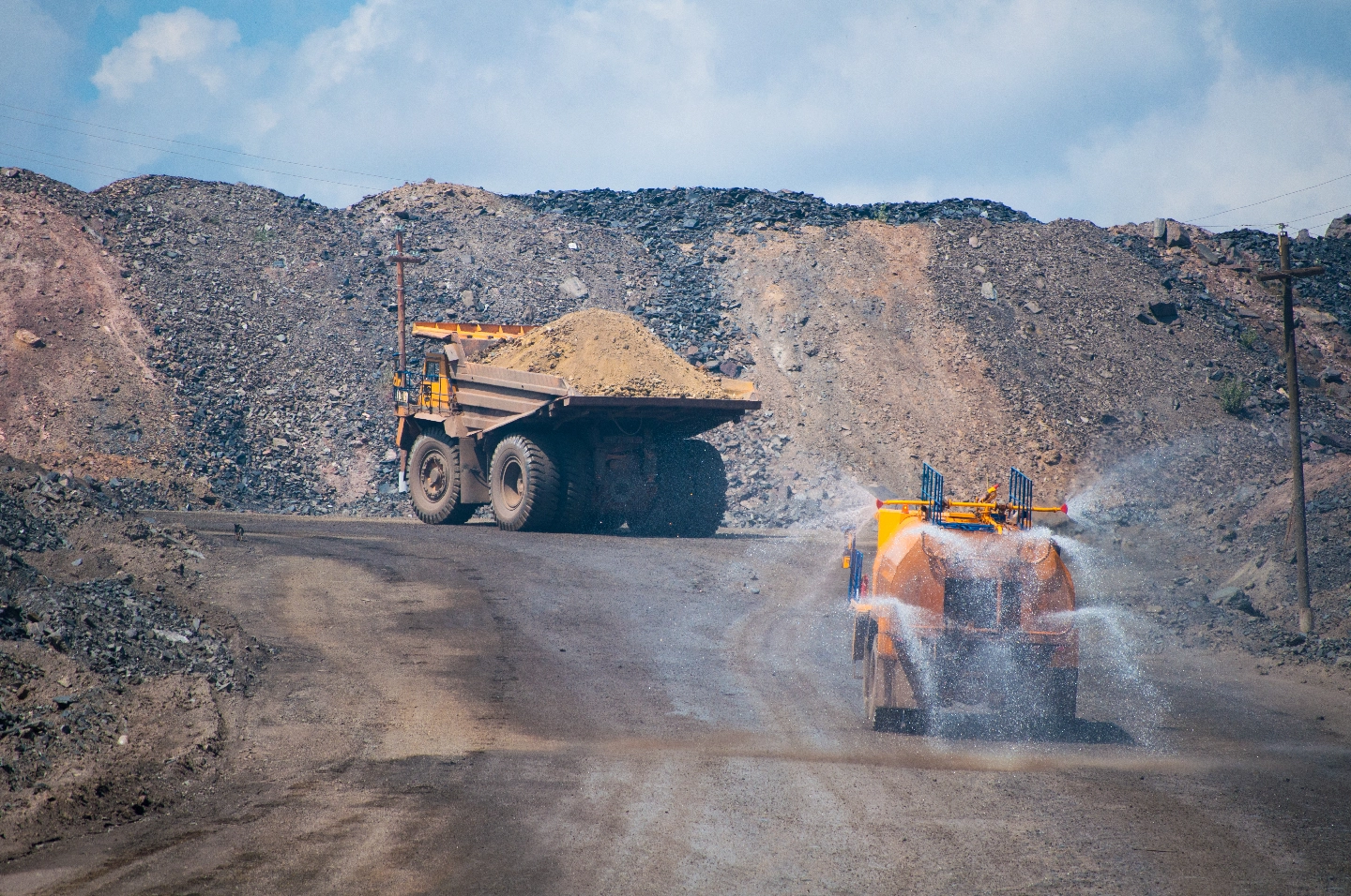 Large mining truck on dusty haul road